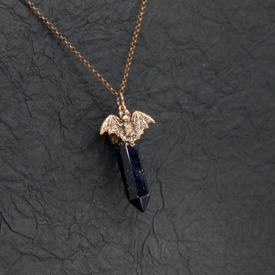 BLUE GOLDSTONE POINT WITH BAT PENDANT